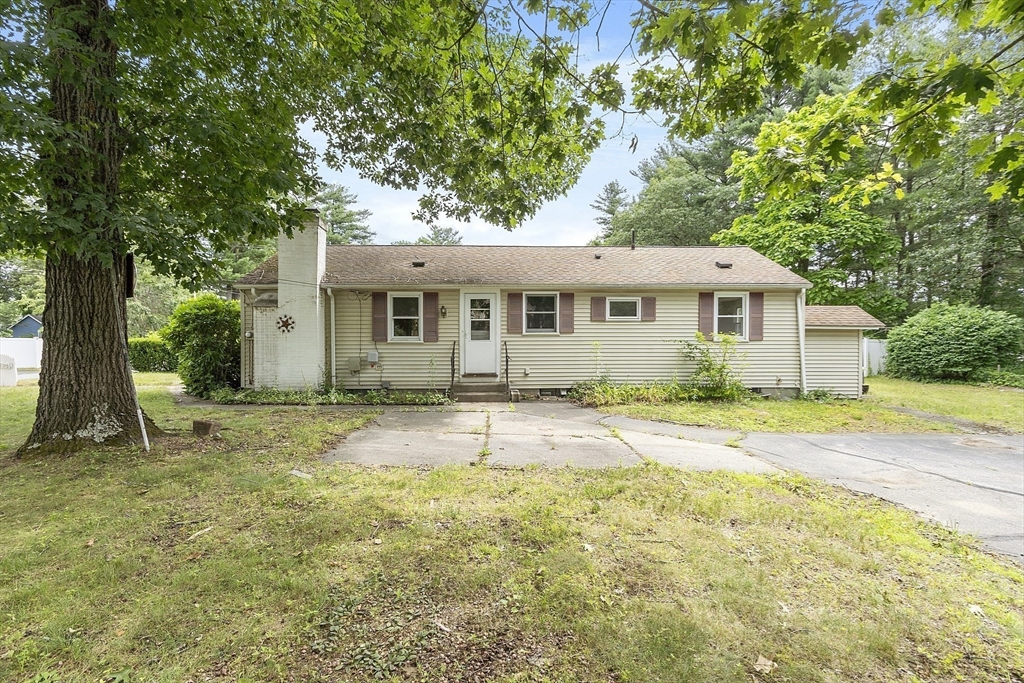 front view of a house with a yard