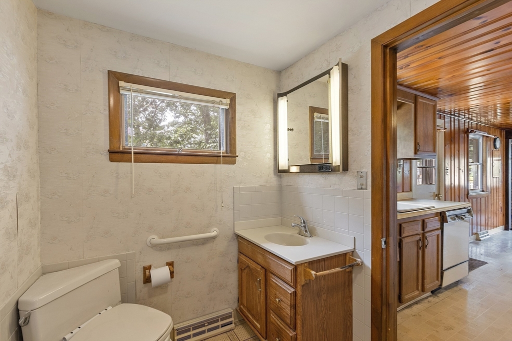 31 Birch Road Westford, MA 01886 - Photo 16 of 42 a bathroom with a toilet sink and mirror