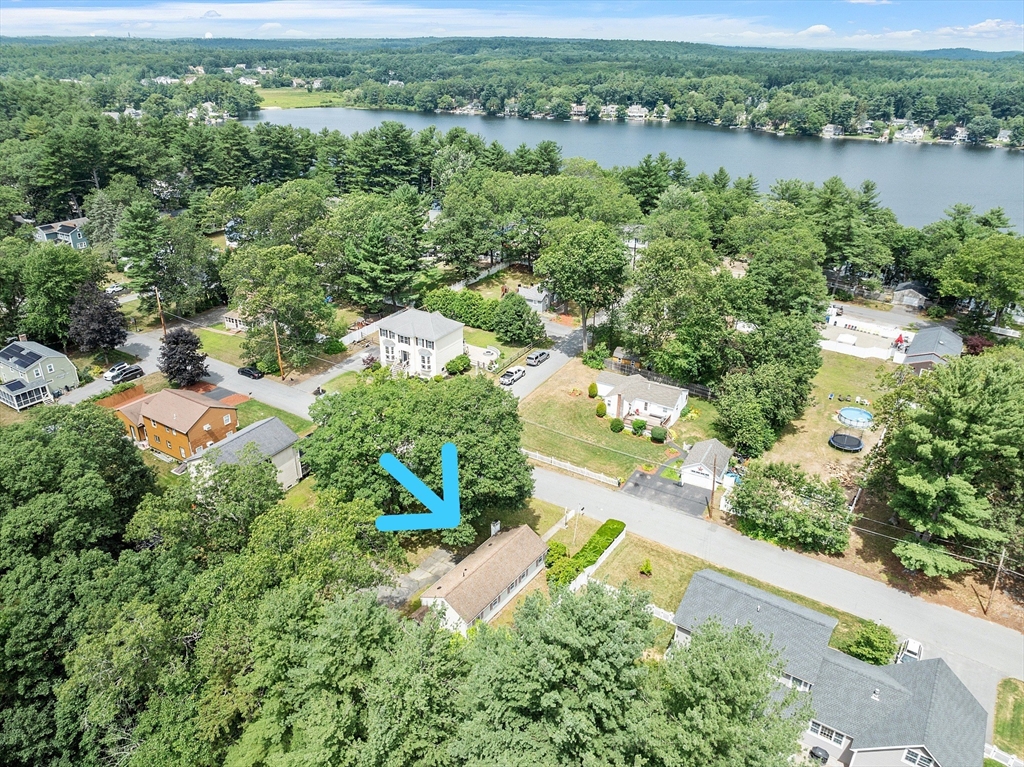 31 Birch Road Westford, MA 01886 - Photo 34 of 42 an aerial view of green landscape with trees houses and lake view