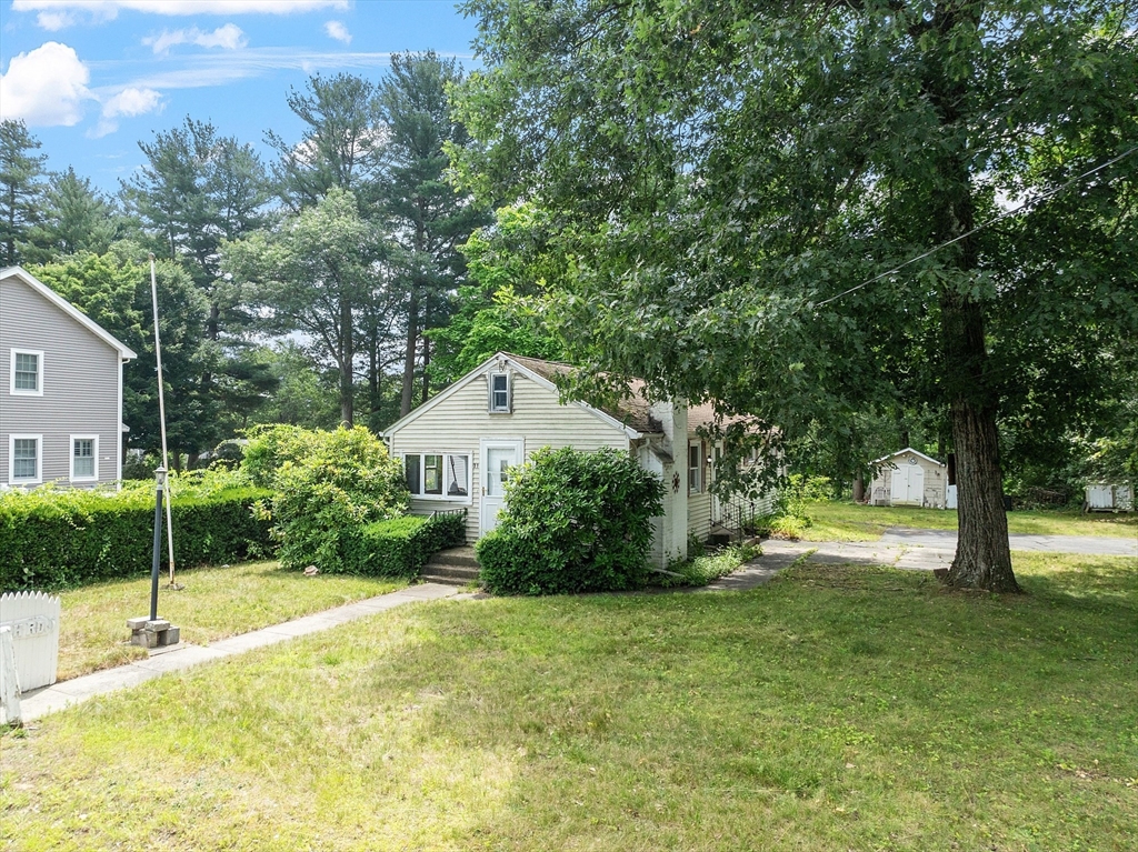 31 Birch Road Westford, MA 01886 - Photo 4 of 42 a view of a house with a backyard and a tree
