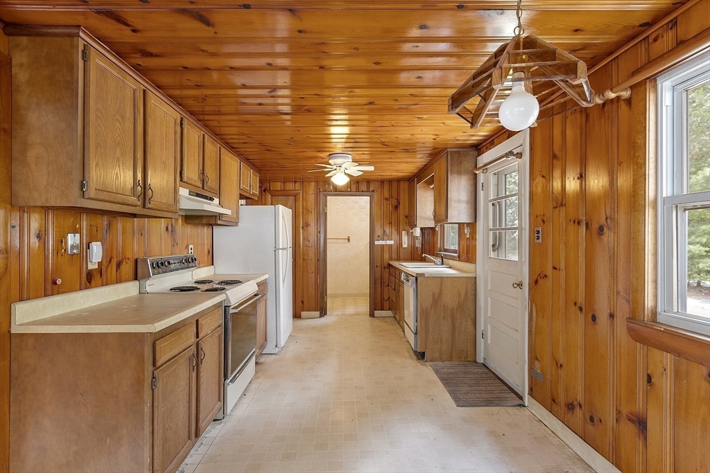31 Birch Road Westford, MA 01886 - Photo 7 of 42 a kitchen that has a lot of cabinets in it and stainless steel appliances