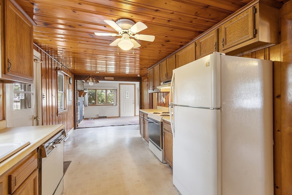 31 Birch Road Westford, MA 01886 - Photo 8 of 42 a kitchen with refrigerator and windows