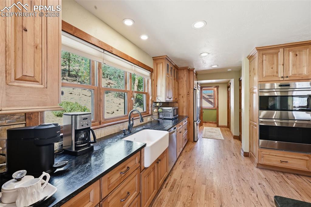 89 Ranch View Road Florissant, CO 80816 - Photo 20 of 50 Farmhouse sink is accompanied by picturesque windows, so you can get lost in nature's beauty, even while preparing dinner.