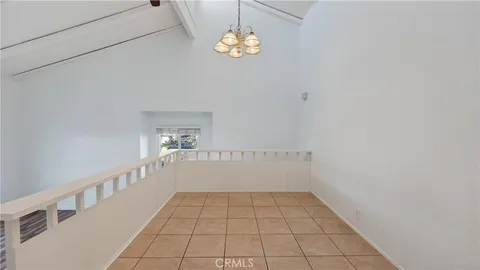 a view of a hallway with a chandelier