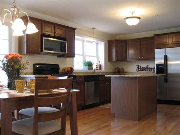 1975 Middlesex Street, Unit 72 Lowell, MA 01851 - Photo 2 of 5 a kitchen with granite countertop a refrigerator stove top oven and sink
