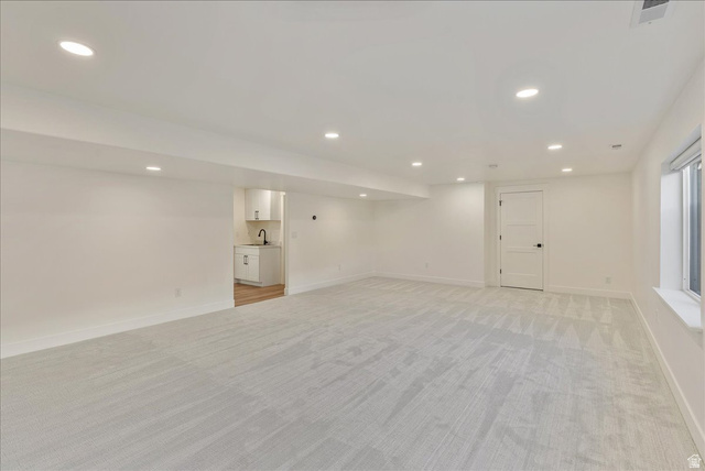 882 Spring Dew Lane Lehi, UT 84048 - Photo 42 of 46 Finished basement with recessed lighting and light carpet