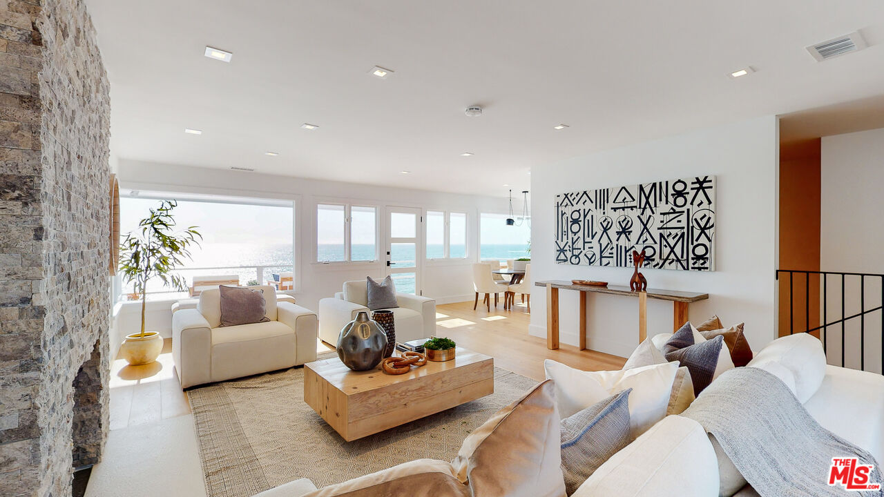 7 Camel Point Drive Laguna Beach, CA 92651 - Photo 12 of 52 a living room with furniture and a large window