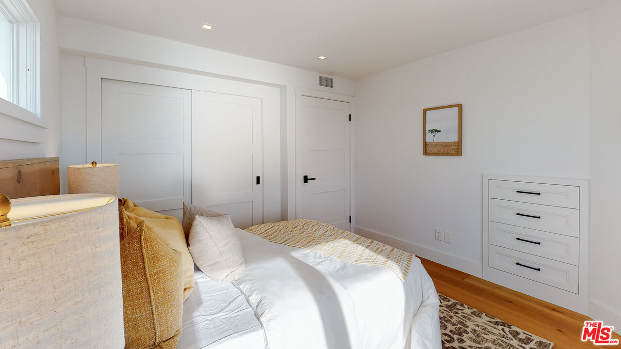 7 Camel Point Drive Laguna Beach, CA 92651 - Photo 27 of 52 a bedroom with a bed and a cabinets