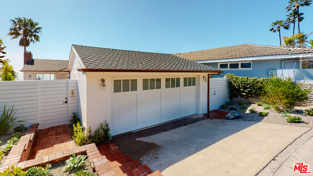 7 Camel Point Drive Laguna Beach, CA 92651 - Photo 35 of 52 a front view of a house with garden