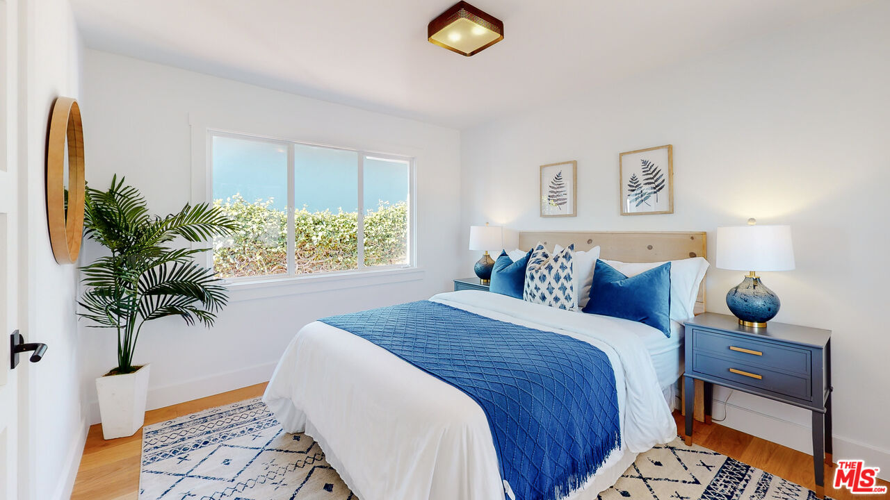 7 Camel Point Drive Laguna Beach, CA 92651 - Photo 44 of 52 a bed sitting in a bedroom next to a window