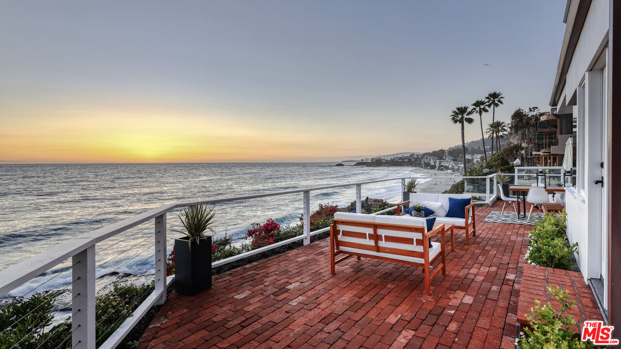 7 Camel Point Drive Laguna Beach, CA 92651 - Photo 47 of 52 a view of a balcony with wooden floor and outdoor seating