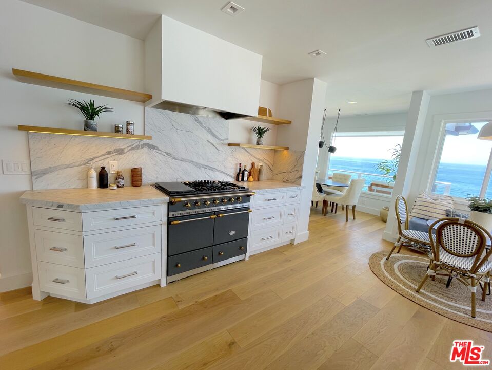 7 Camel Point Drive Laguna Beach, CA 92651 - Photo 7 of 52 a kitchen with a stove and cabinets