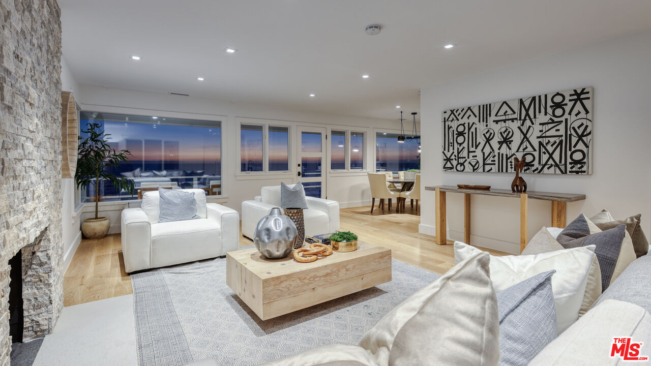 7 Camel Point Drive Laguna Beach, CA 92651 - Photo 9 of 52 a living room with furniture kitchen view and a large window