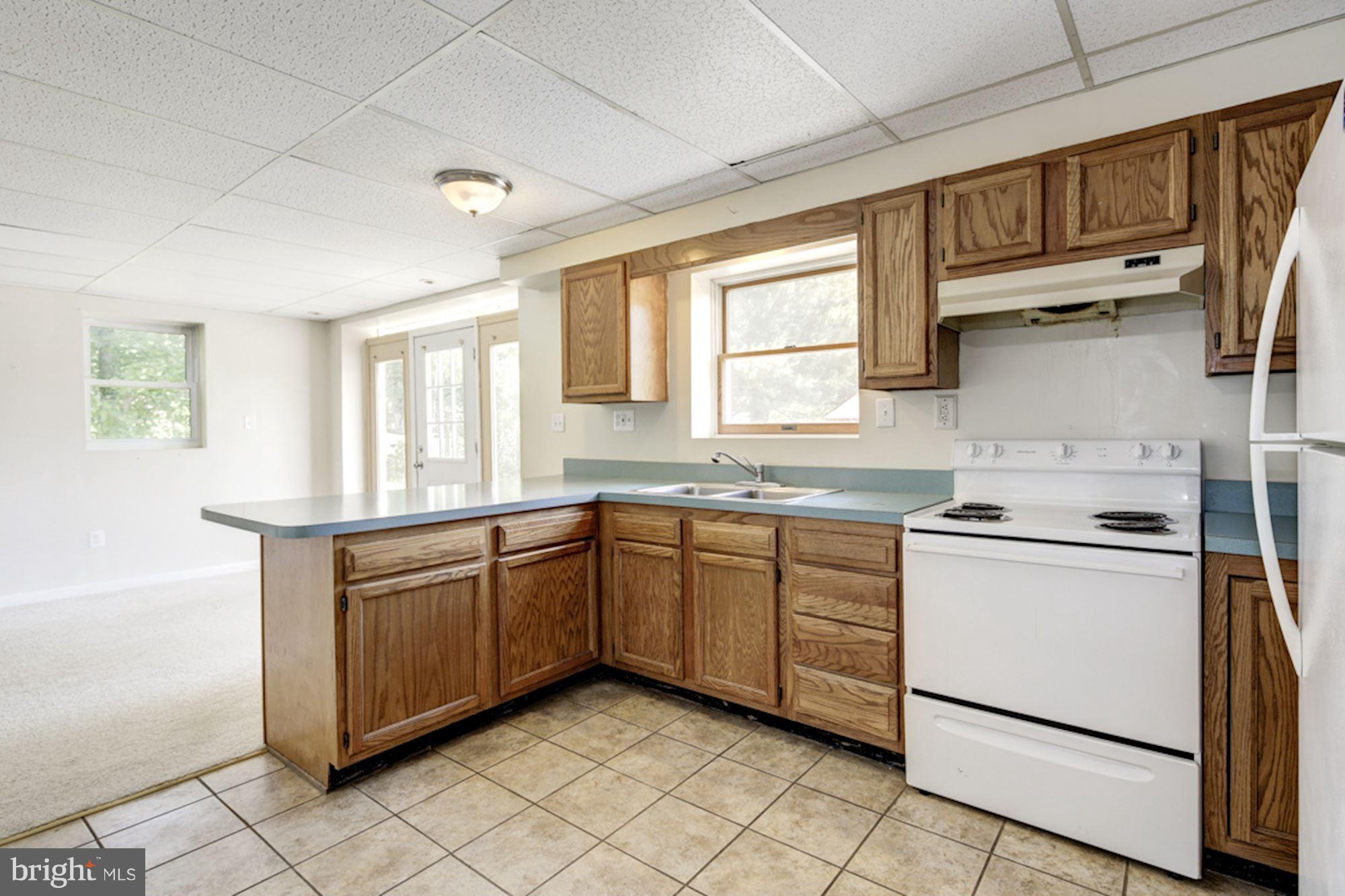 82 East Nicodemus Road Westminster, MD 21157 - Photo 22 of 30 a kitchen with stainless steel appliances granite countertop a stove a sink and a refrigerator