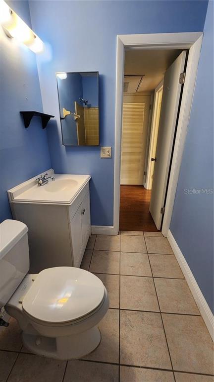 4801 Airport Road, Unit 118 Zephyrhills, FL 33542 - Photo 18 of 19 a bathroom with a sink a toilet and mirror