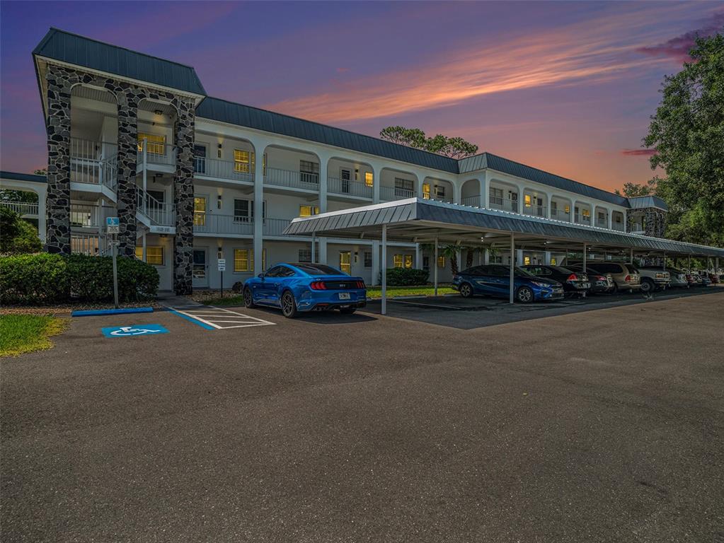 4801 Airport Road, Unit 118 Zephyrhills, FL 33542 - Photo 2 of 19 a car parked in front of building