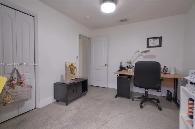 a workspace with furniture and a chair