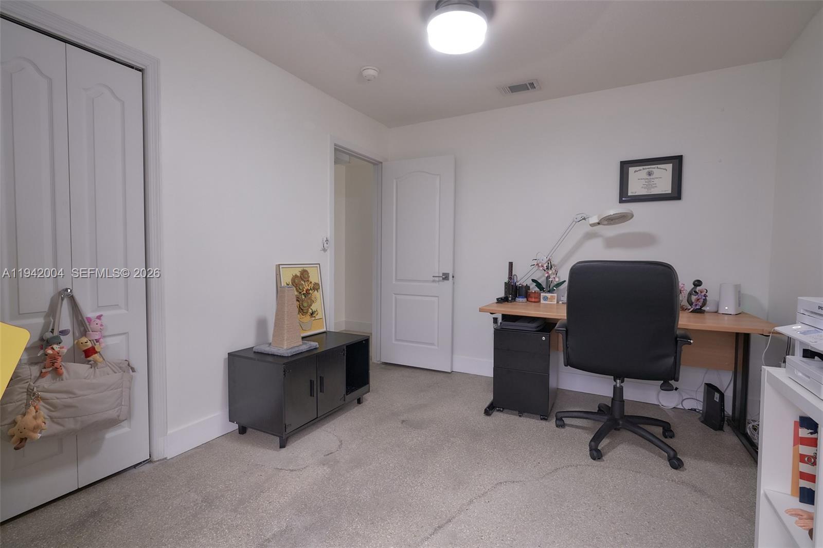 15213 Southwest 141st Street Miami, FL 33196 - Photo 15 of 18 a workspace with furniture and a chair