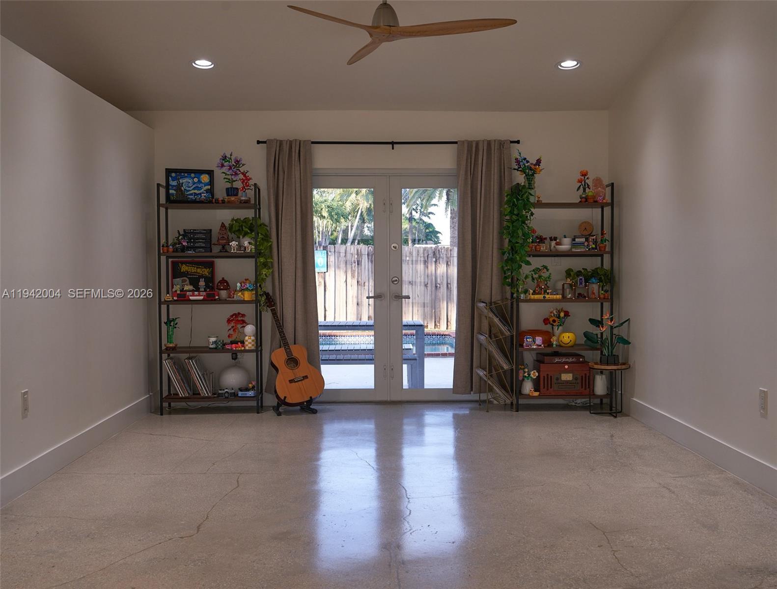 15213 Southwest 141st Street Miami, FL 33196 - Photo 2 of 18 a view of a room with gym equipment