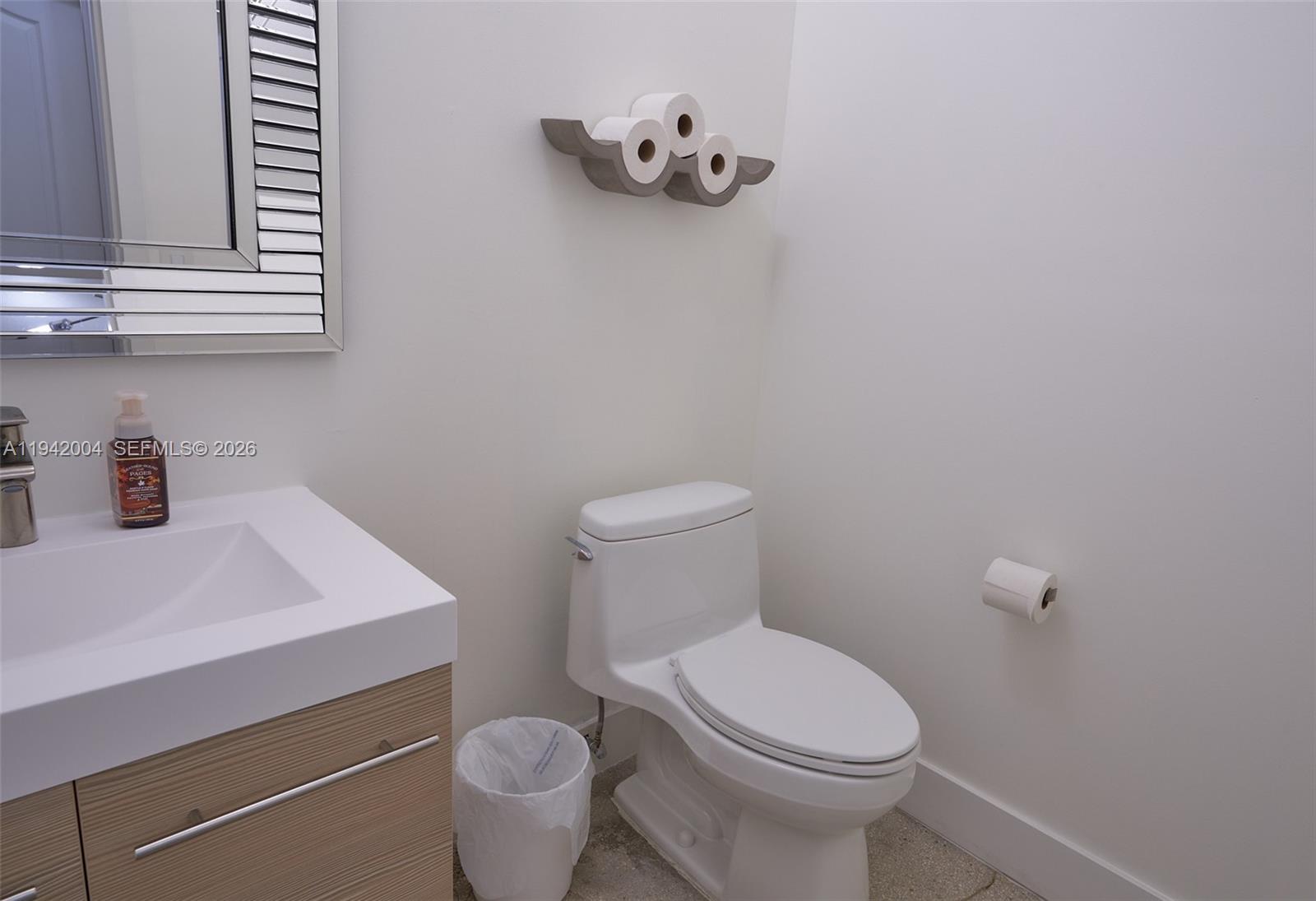 15213 Southwest 141st Street Miami, FL 33196 - Photo 9 of 18 a bathroom with a sink a toilet and a window