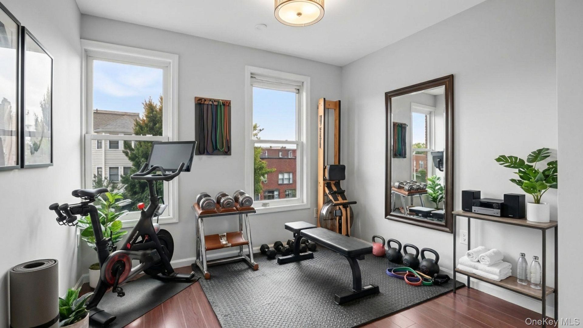 2040 Washington Avenue Bronx, NY 10457 - Photo 6 of 26 Exercise area with plenty of natural light and wood-type flooring