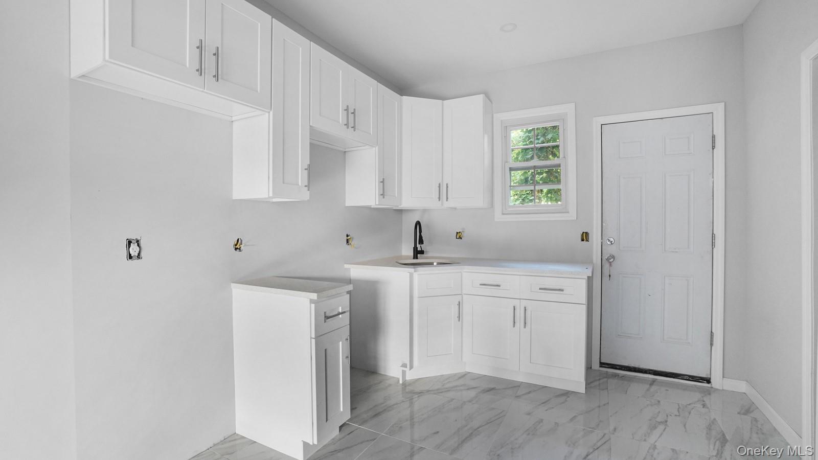 2040 Washington Avenue Bronx, NY 10457 - Photo 9 of 26 Washroom featuring light marble finish floors and a sink