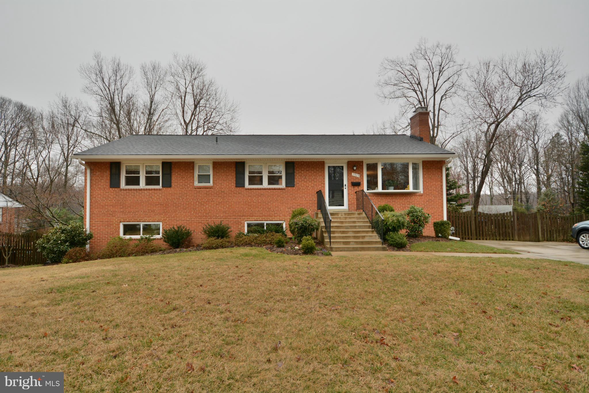 7909 Slidell Lane Springfield, VA 22151 - Photo 2 of 30 a front view of house with yard and trees around