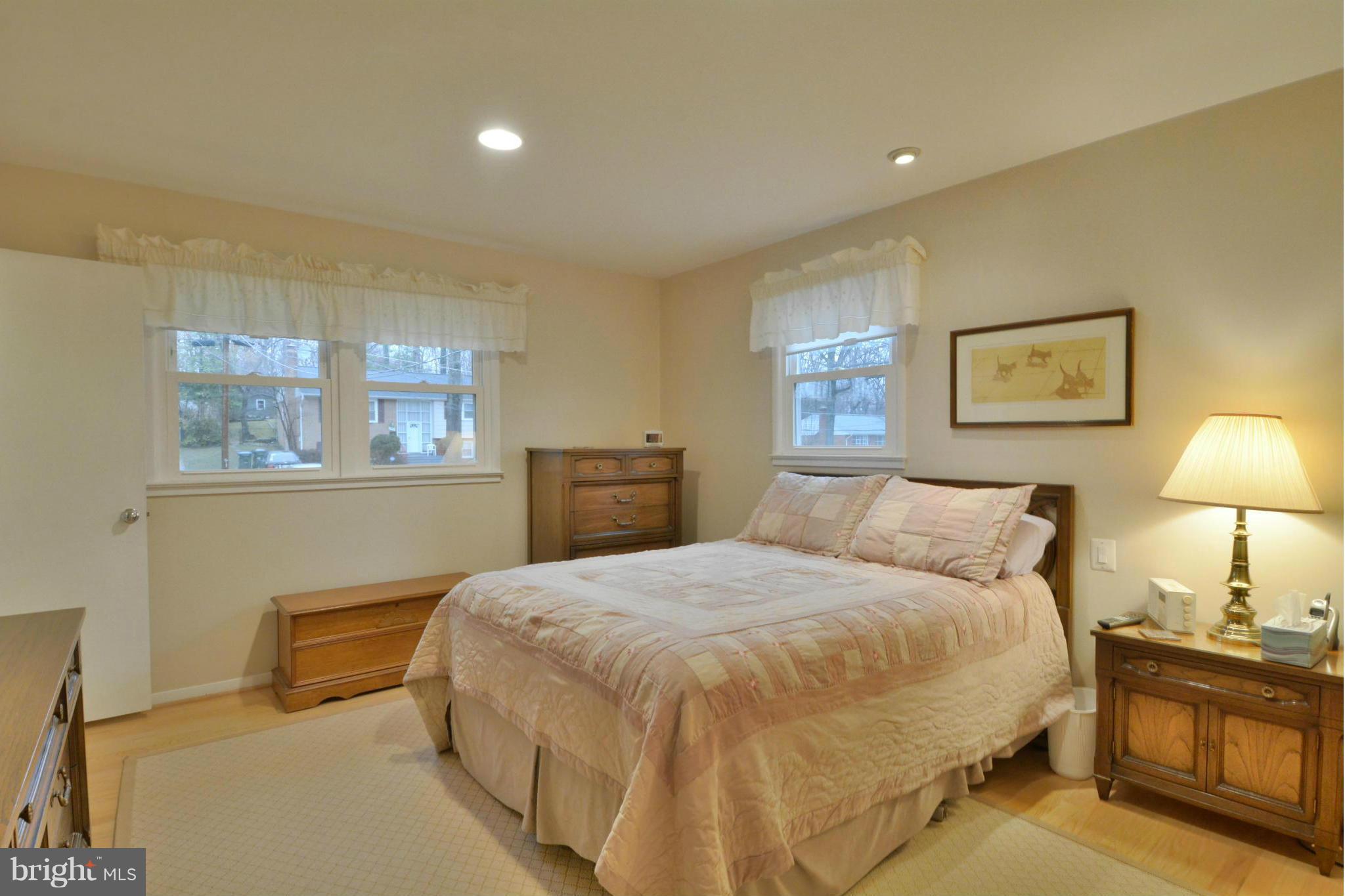 7909 Slidell Lane Springfield, VA 22151 - Photo 11 of 30 a bedroom with a bed and wooden floor