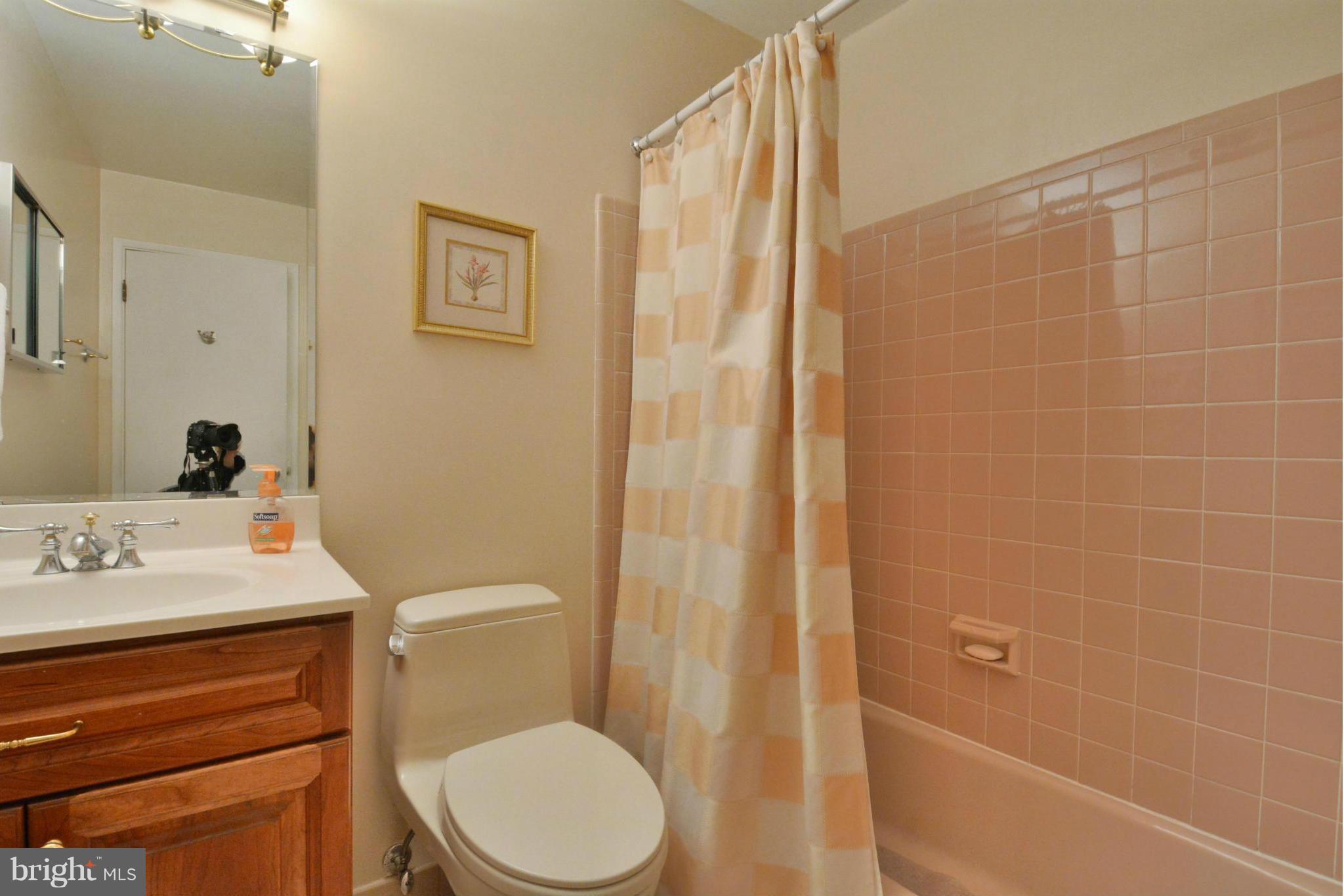 7909 Slidell Lane Springfield, VA 22151 - Photo 12 of 30 a bathroom with a sink a toilet and shower
