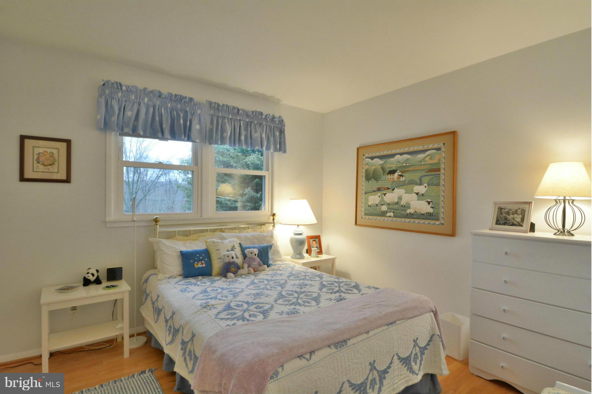 7909 Slidell Lane Springfield, VA 22151 - Photo 15 of 30 a bedroom with a bed and a window