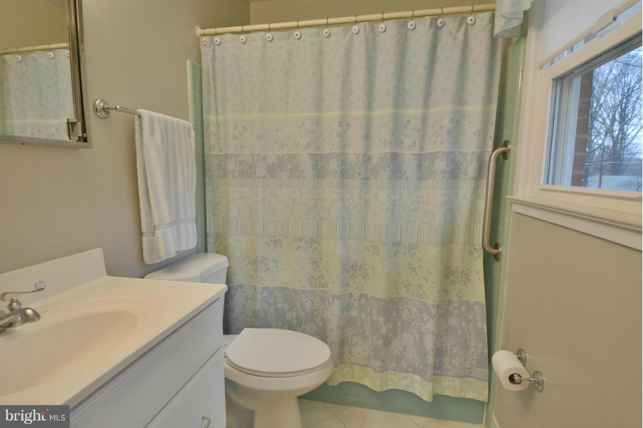 7909 Slidell Lane Springfield, VA 22151 - Photo 17 of 30 a bathroom with a sink and toilet