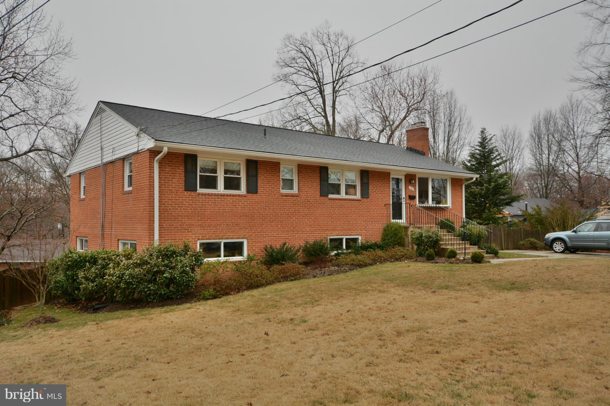 7909 Slidell Lane Springfield, VA 22151 - Photo 3 of 30 a front view of a house with a yard