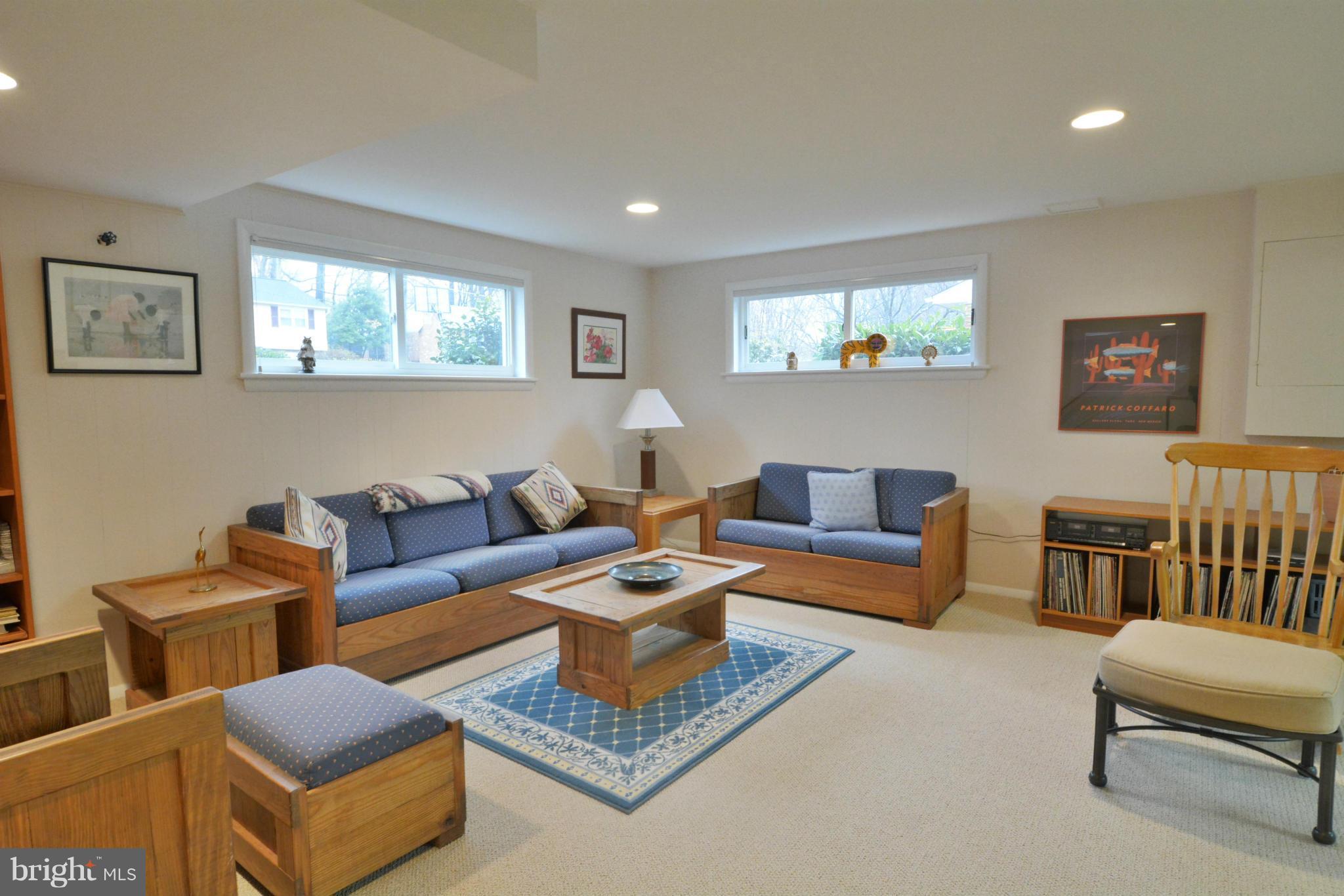 7909 Slidell Lane Springfield, VA 22151 - Photo 21 of 30 a living room with furniture a rug and a window
