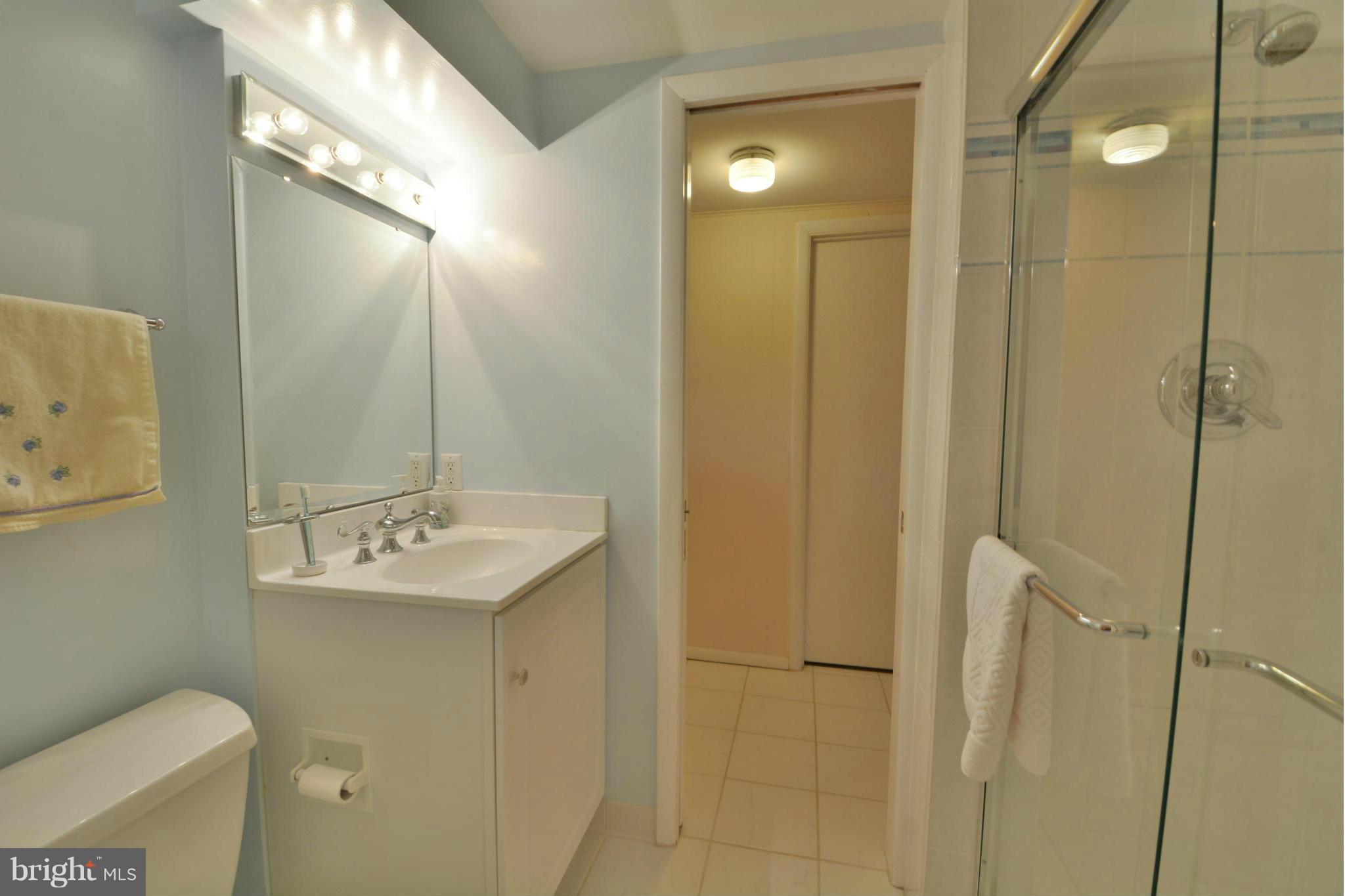 7909 Slidell Lane Springfield, VA 22151 - Photo 26 of 30 a bathroom with a sink toilet and shower