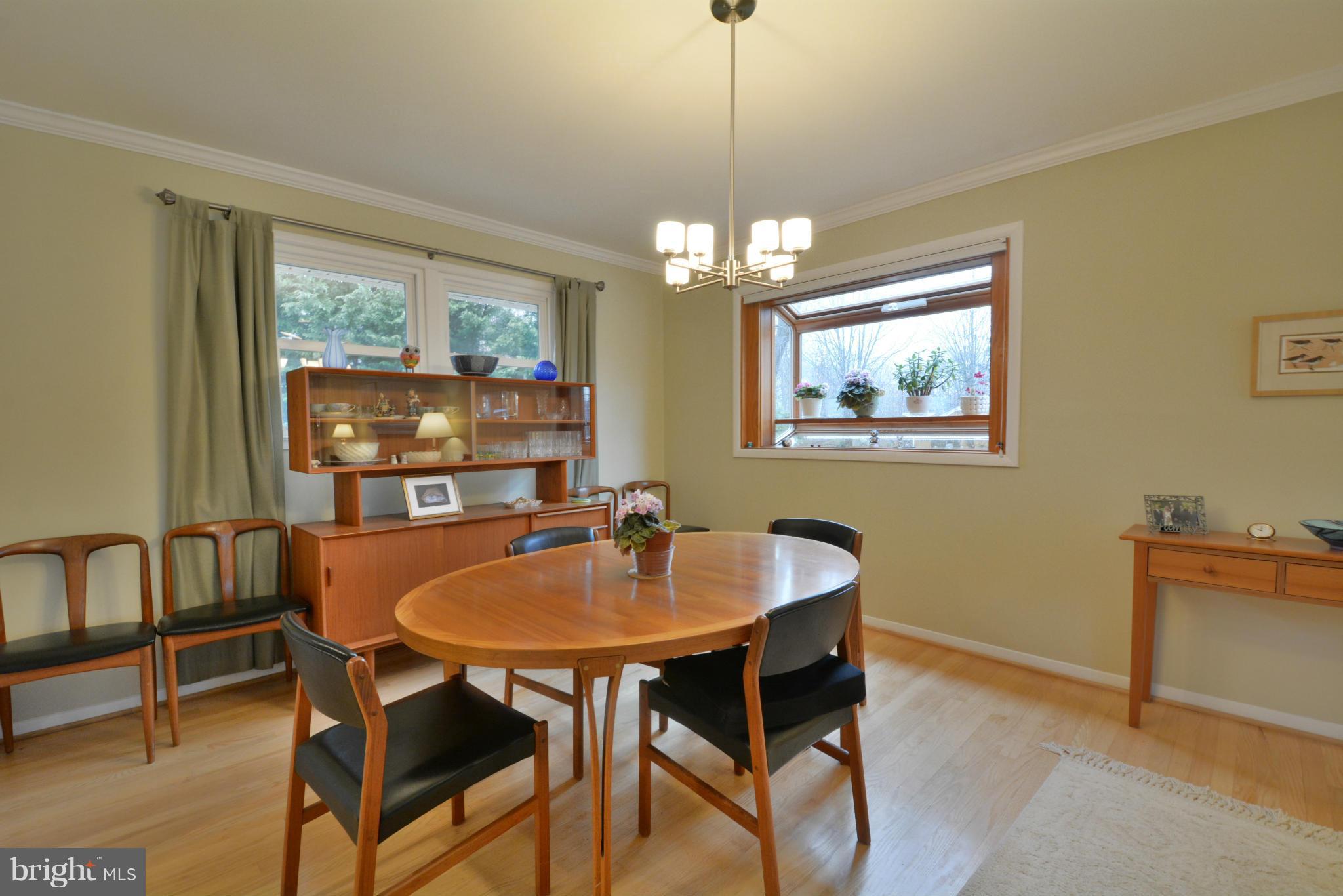 7909 Slidell Lane Springfield, VA 22151 - Photo 7 of 30 a dining room with furniture a chandelier and wooden floor