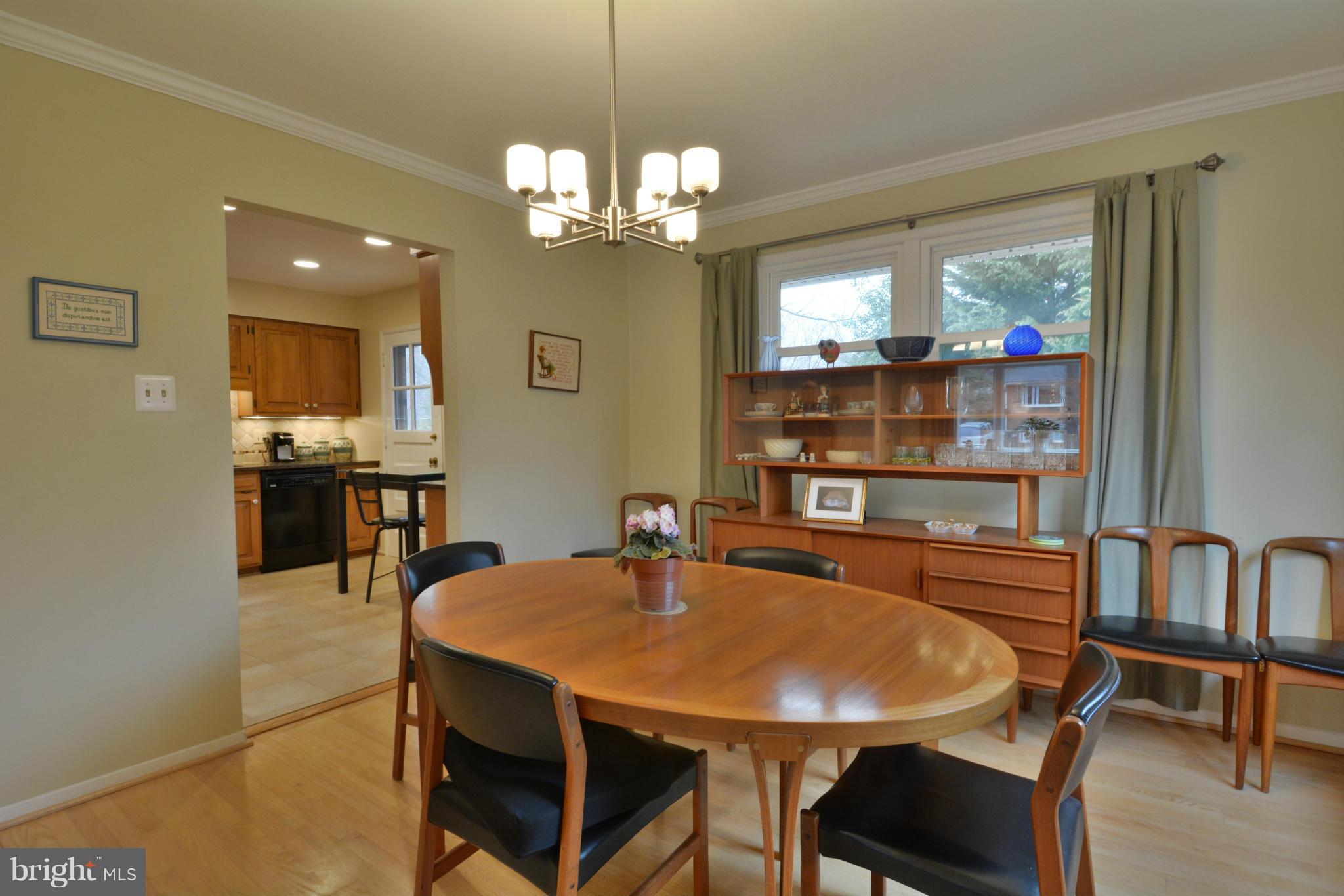 7909 Slidell Lane Springfield, VA 22151 - Photo 8 of 30 a view of a dining room with furniture and a chandelier