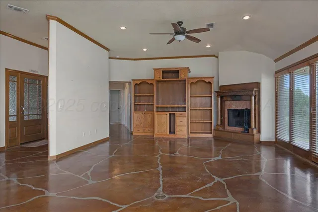 a living room with closet and a fireplace