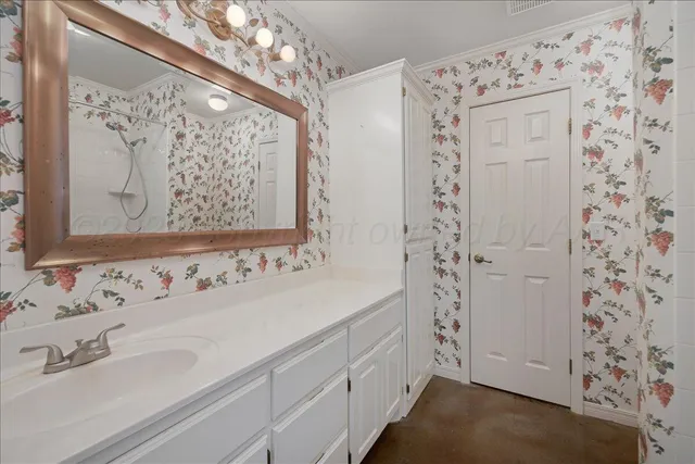 a bathroom with a bath tub with a shower
