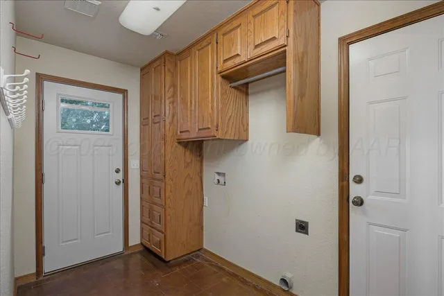a bathroom with a sink a light fixture and a toilet