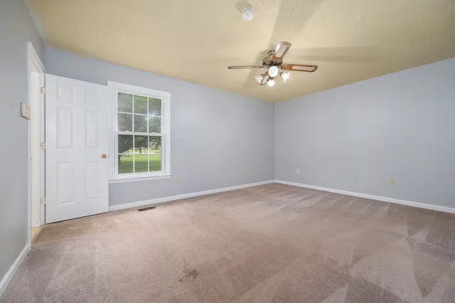 a view of an empty room with a garage