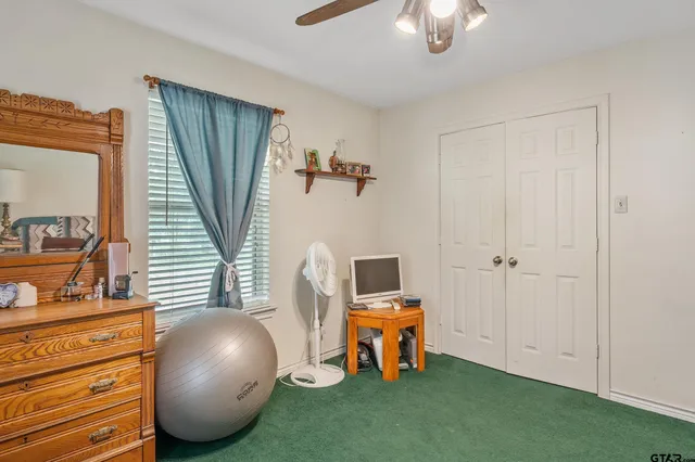 a view of a livingroom with furniture and windows