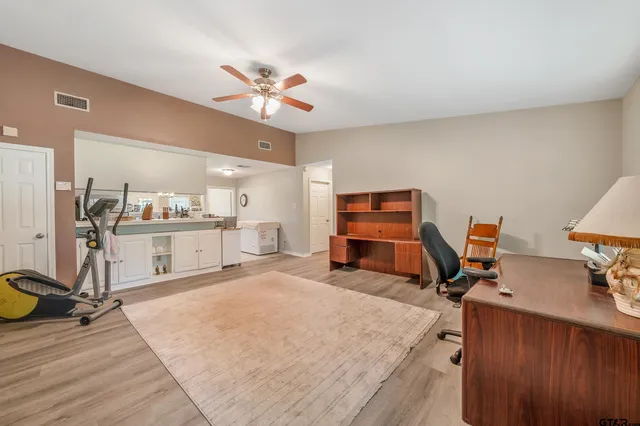 a room with furniture and gym equipment