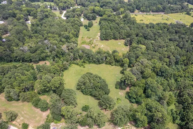 a view of a lake with a yard