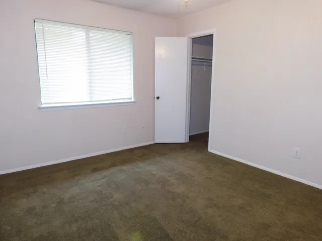 a bathroom with a toilet and a bathtub