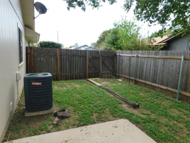 a view of a back yard of the house