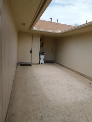 an empty room with a ceiling fan