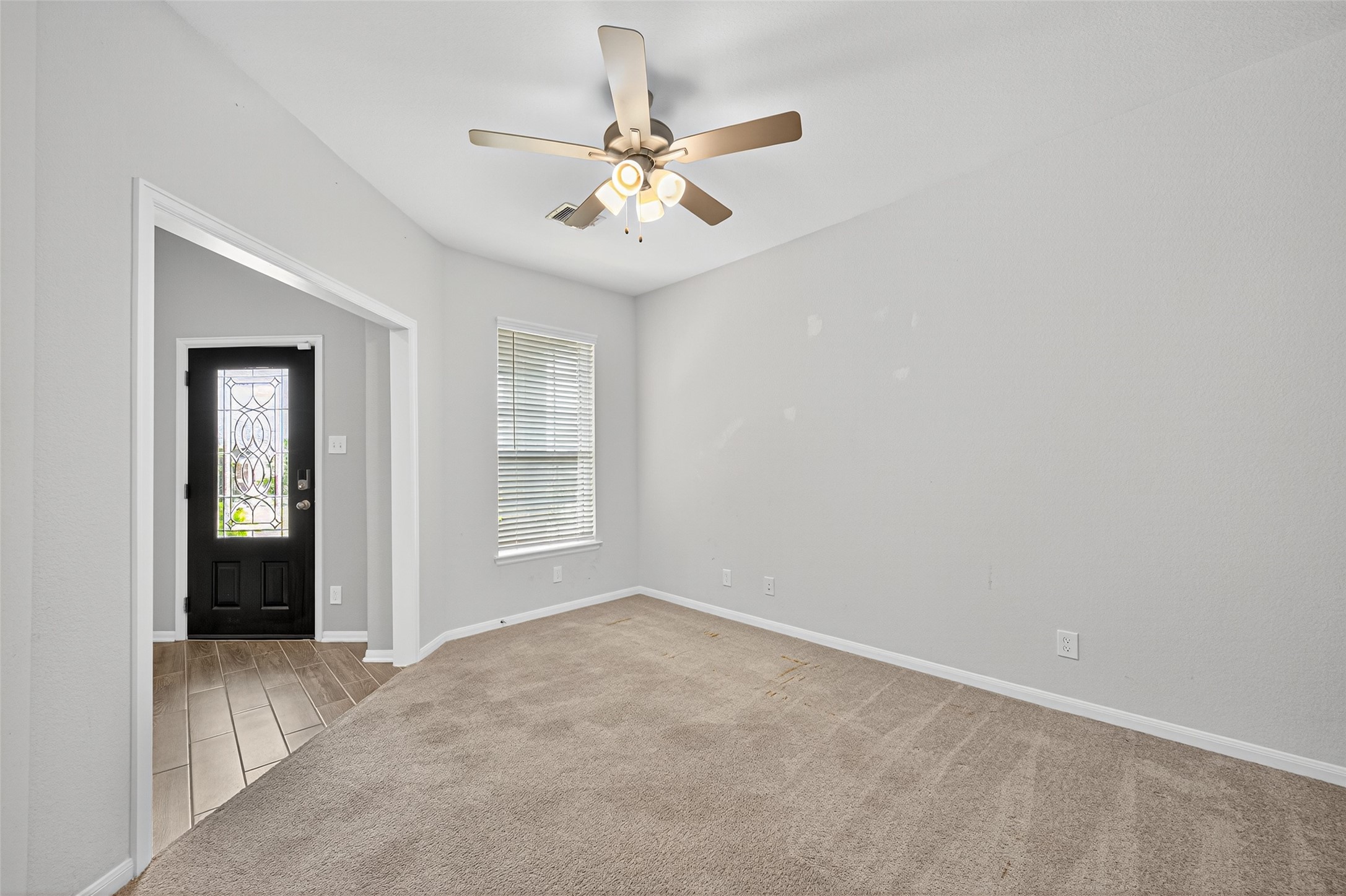 1312 Mainland Shores Lane Montgomery, TX 77316 - Photo 12 of 50 a view of an empty room with a window