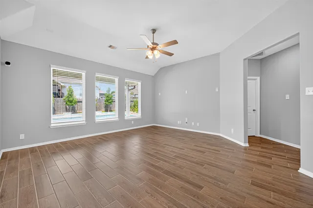 a kitchen with stainless steel appliances granite countertop a sink a stove and cabinets