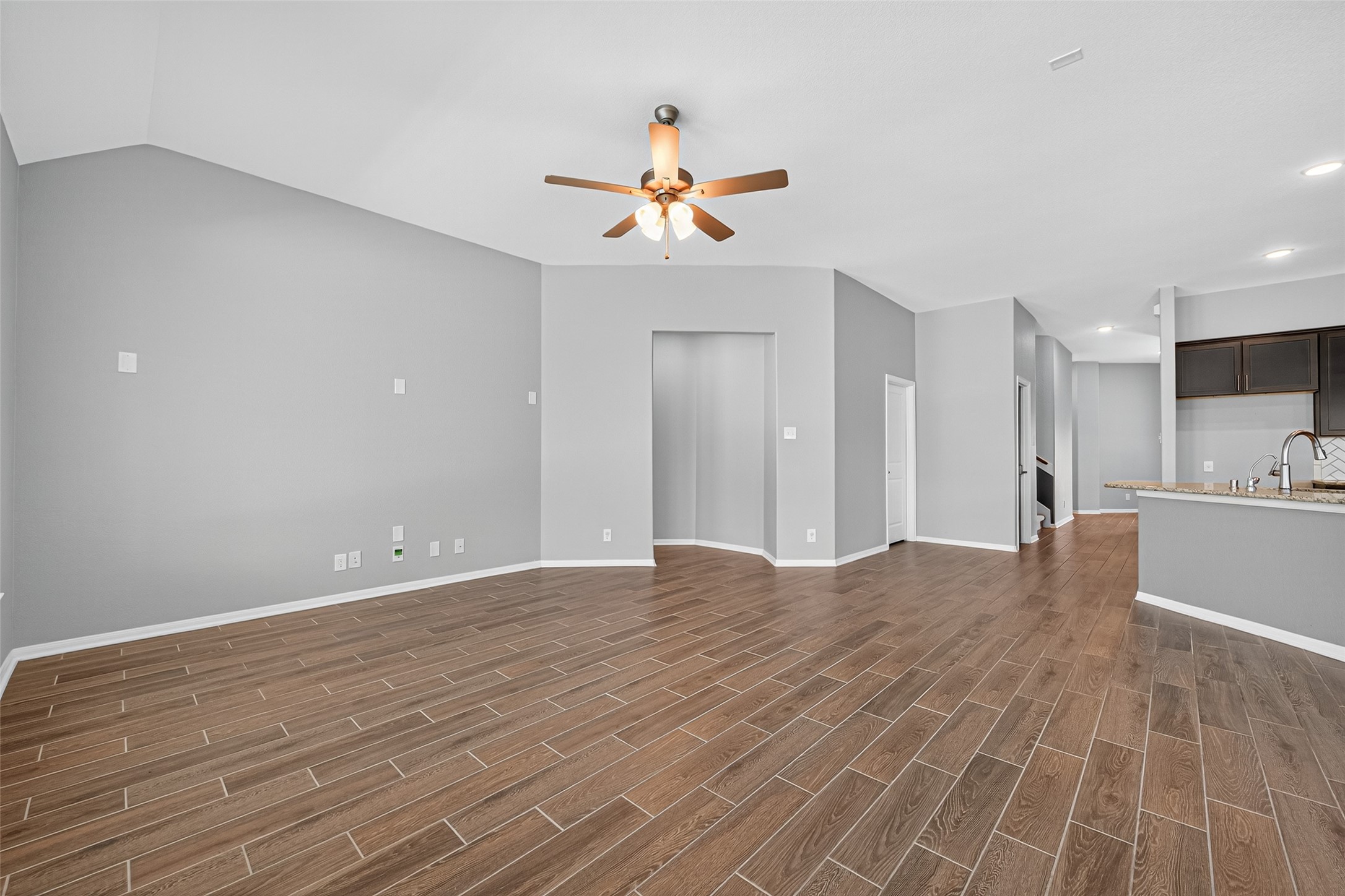 1312 Mainland Shores Lane Montgomery, TX 77316 - Photo 14 of 50 a view of empty room with wooden floor and fan