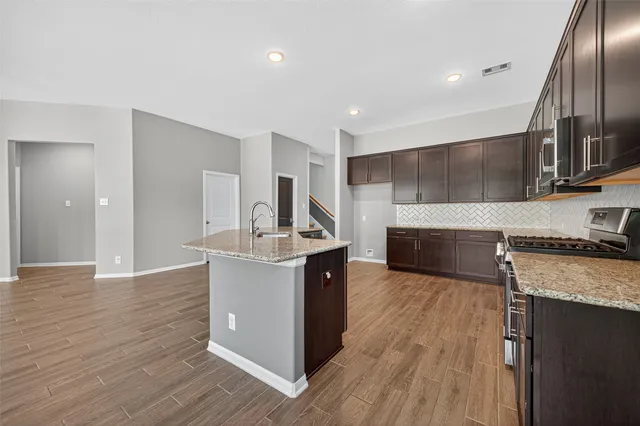 a view of an empty room and closet area